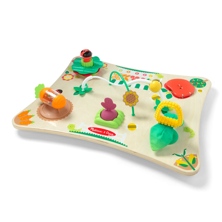 The loose pieces of The Farmers Market 3 in 1 Activity Center