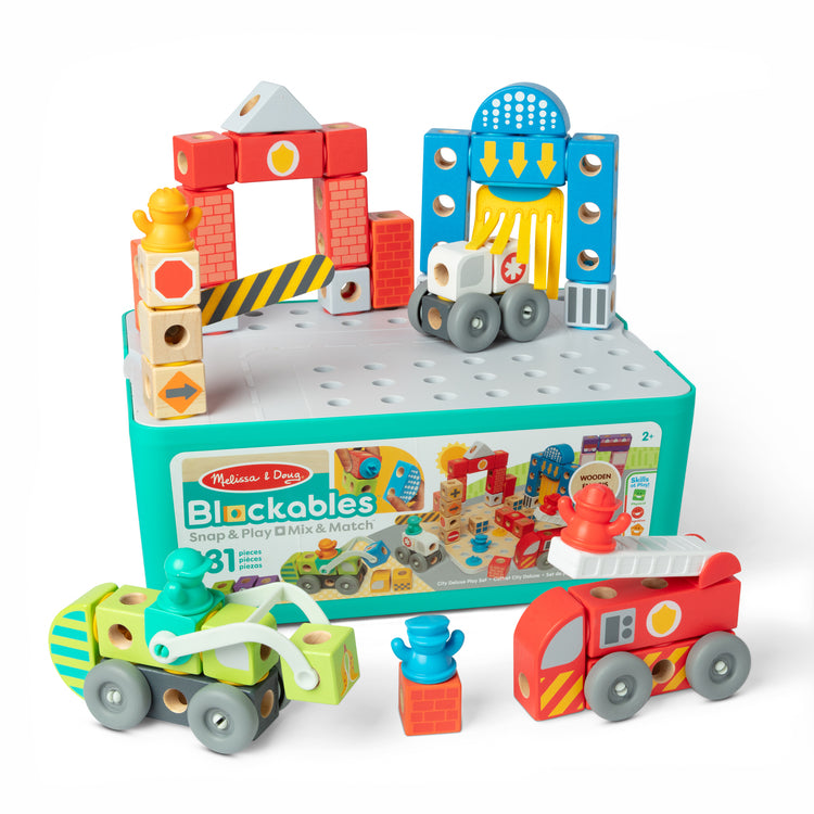 The loose pieces of The Melissa & Doug Blockables™ Deluxe City Snap And Play Amazon Exclusive, Mix and Match Connectable Wooden Building Blocks Play Set With Storage Bin and Play Lid (122 Pcs)