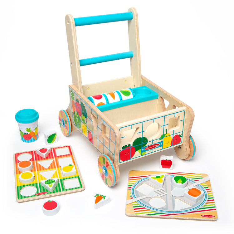 The loose pieces of The Melissa & Doug Wooden Shape Sorting Grocery Cart Push Toy and Puzzles