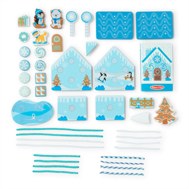 The loose pieces of The Melissa & Doug Winter Frost Wooden Gingerbread House Play Set for Boys and Girls 3+ 