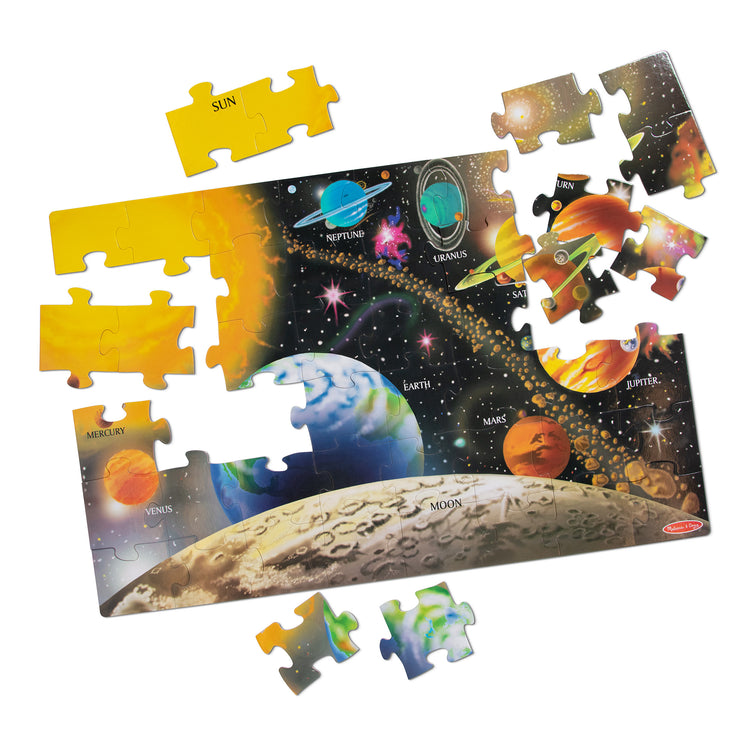 The loose pieces of The Melissa & Doug Solar System Floor Puzzle (48 pcs, 2 x 3 Feet)