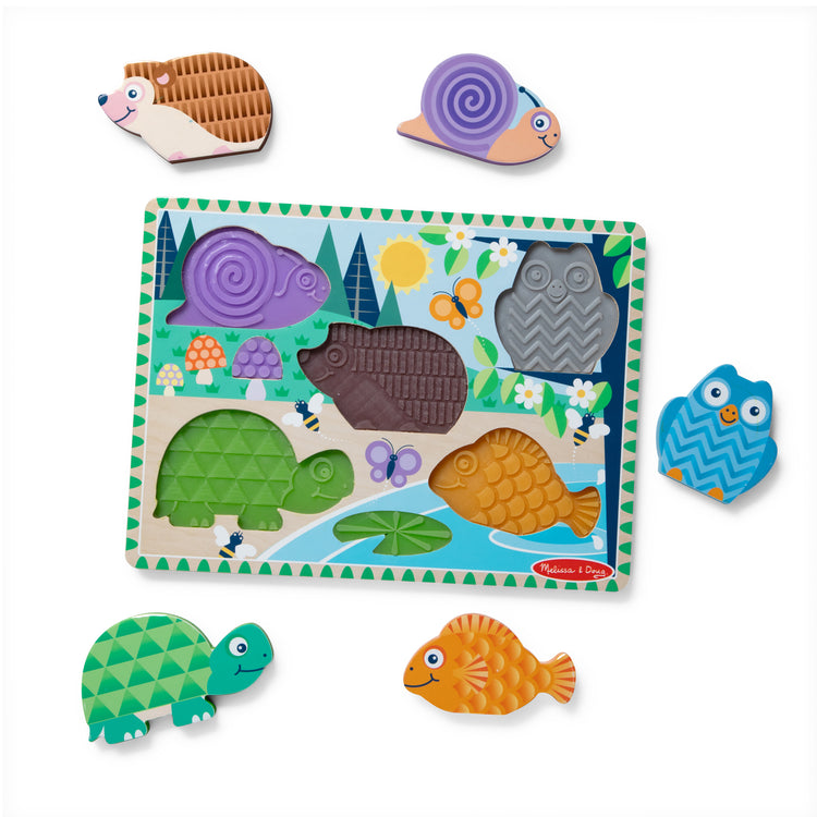 The loose pieces of The Forest Friends Touch & Feel Puzzle