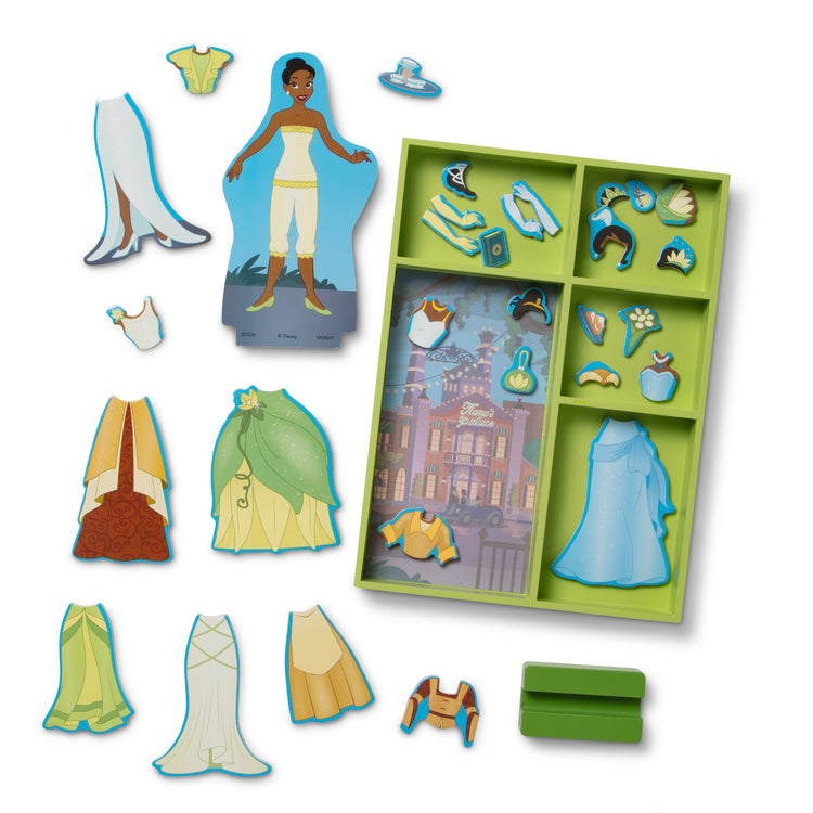 The loose pieces of The Melissa & Doug Disney Princess Tiana Magnetic Dress-Up Wooden Doll Pretend Play Set (30+ pcs)
