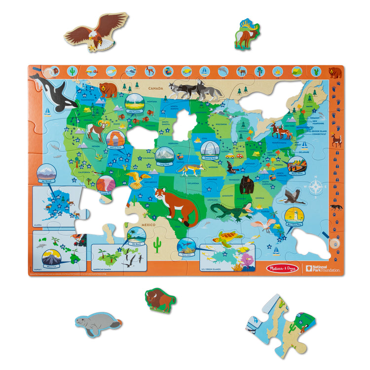 The loose pieces of The Melissa & Doug National Parks U.S.A. Map Floor Puzzle – 45 Jumbo and Animal Shaped Pieces, Search-and-Find Activities, Park and Animal ID Guide
