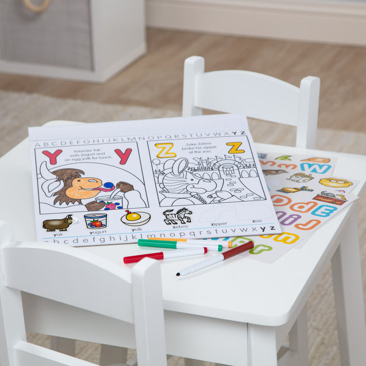 A playroom scene with The Melissa & Doug Alphabet Activity Sticker Pad for Coloring, Letters (250+ Stickers)