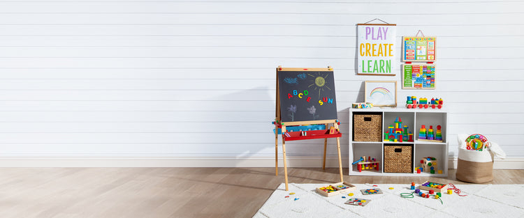 Playroom with deluxe standing easel, rainbow letter magnets, rainbow blocks, and rainbow stacker toy