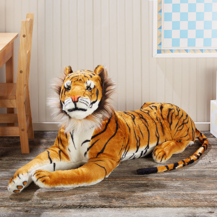 A playroom scene with The Melissa & Doug Giant Tiger - Lifelike Stuffed Animal, Over 5 Feet Long (Includes Tail)