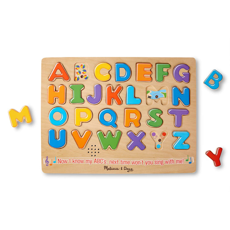 The loose pieces of The Melissa & Doug Wooden Alphabet Sound Puzzle - Wooden Puzzle With Sound Effects (26 pcs)