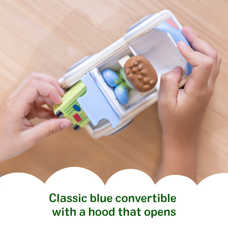 A kid playing with The Melissa & Doug Cheery Lane Vehicle and Boy Figure, Wooden Toy Convertible Car Playset - For Ages 2+
