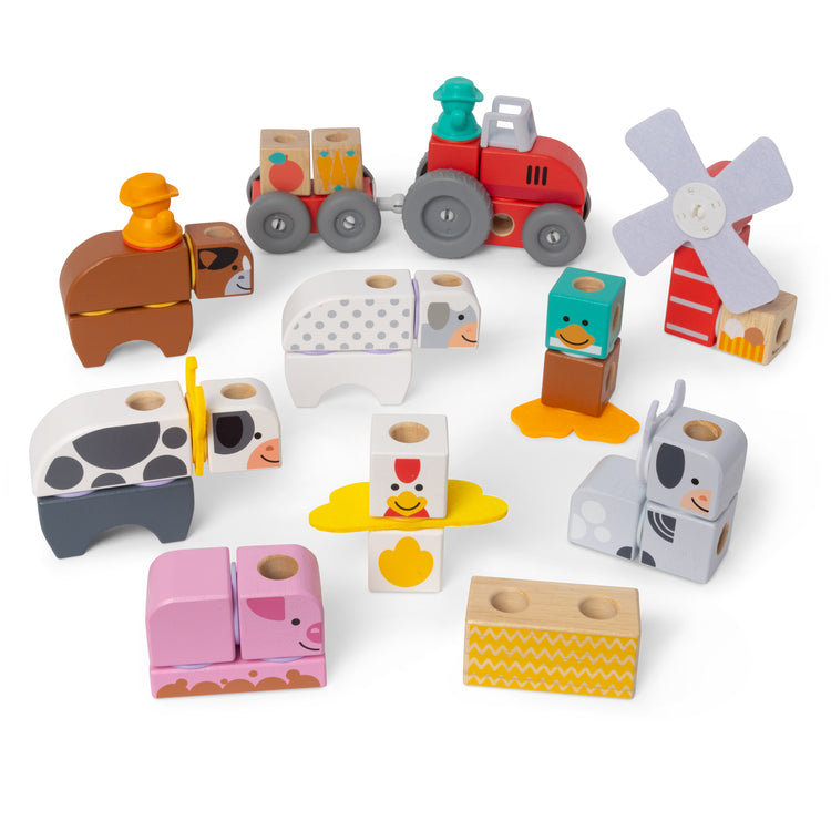 The loose pieces of The Melissa & Doug Blockables™ Farm and Farm Friends 2-Pack Bundle Connectable Wooden Building Blocks Preschool Play Set Toy