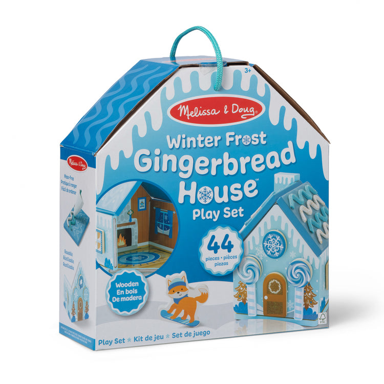 The front of the box for The Melissa & Doug Winter Frost Wooden Gingerbread House Play Set for Boys and Girls 3+ 