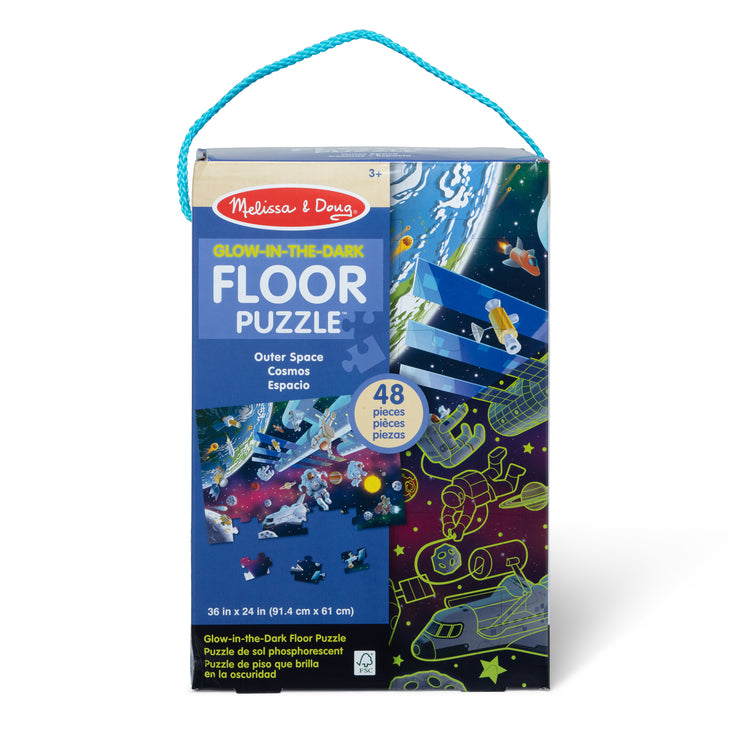 The front of the box for The Melissa & Doug Outer Space Glow-in-the-Dark Cardboard Jigsaw Floor Puzzle – 48 Pieces, for Boys and Girls 3+
