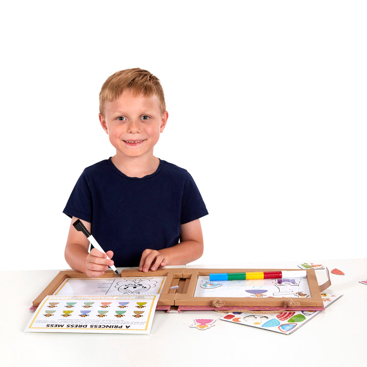 A child on white background with The Melissa & Doug Natural Play: Play, Draw, Create Reusable Drawing & Magnet Kit – Princesses (54 Magnets, 5 Dry-Erase Markers)