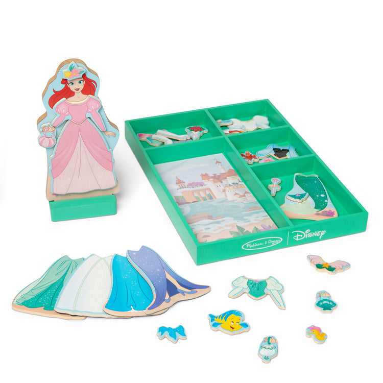 The loose pieces of The Melissa & Doug Disney Princess Ariel Magnetic Dress-Up Wooden Doll Pretend Play Set (30+ Pieces)