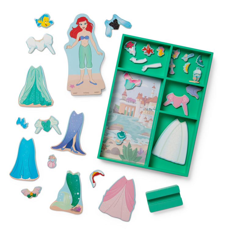 The loose pieces of The Melissa & Doug Disney Princess Ariel Magnetic Dress-Up Wooden Doll Pretend Play Set (30+ Pieces)