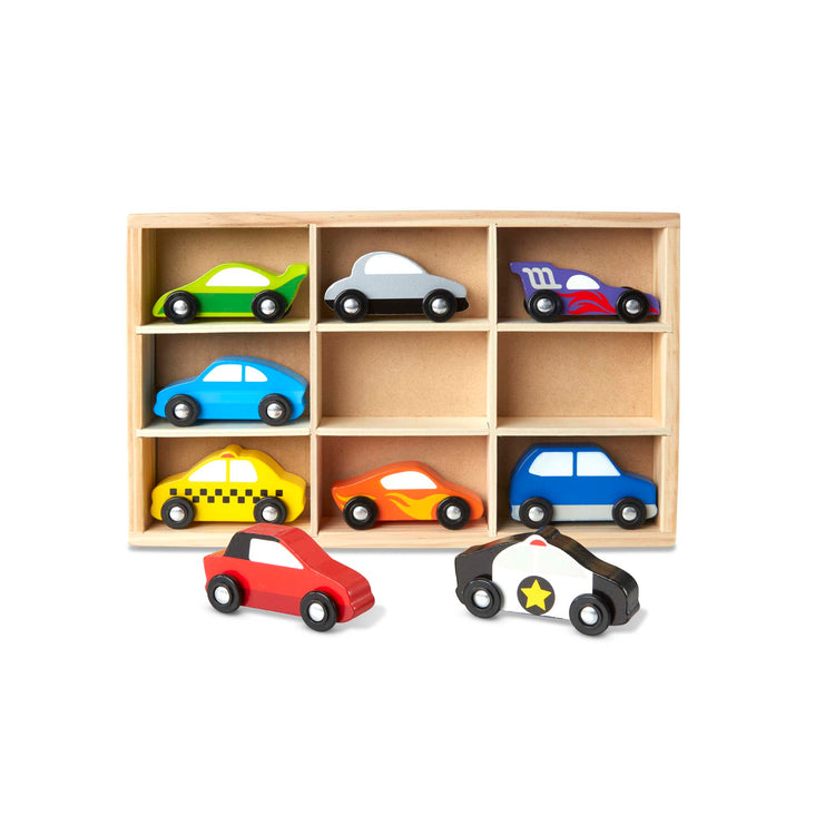 The loose pieces of The Melissa & Doug Wooden Cars Vehicle Set in Wooden Tray