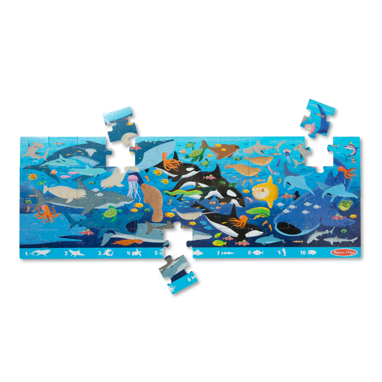 The loose pieces of The Melissa & Doug Beneath the Waves, Ocean-Themed Search and Find Jumbo Floor Puzzle, 48-Piece Jigsaw Puzzle with Learning Activity, Over 4 Ft Long, Kids Puzzles for Girls & Boys Ages 3 and Up