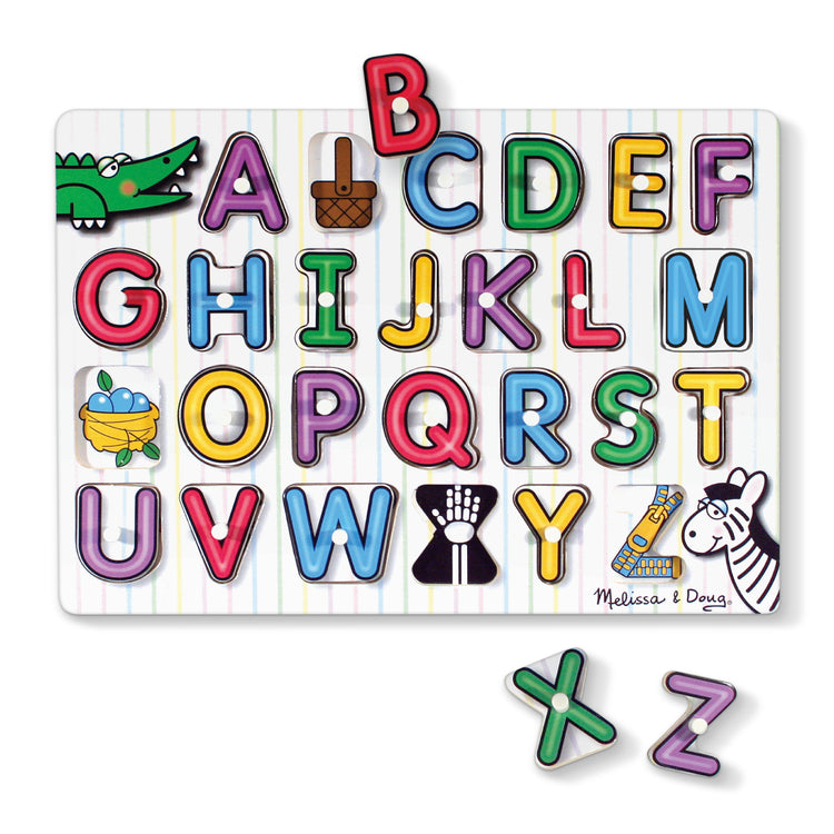 The loose pieces of The Melissa & Doug Lift & See Alphabet Wooden Peg Puzzle (26 pcs)