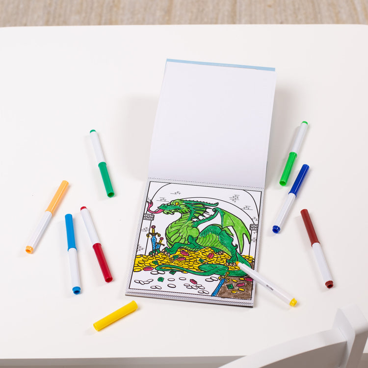 A playroom scene with The Melissa & Doug Magic-Pattern Kids’ Adventure Marker Coloring Pad On the Go Travel Activity