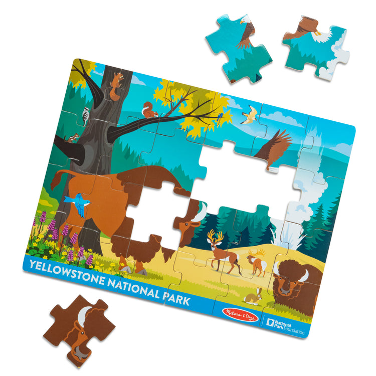 The loose pieces of The Melissa & Doug Yellowstone National Park Wooden Jigsaw Puzzle – 24 Pieces, Animal and Plant ID Guide