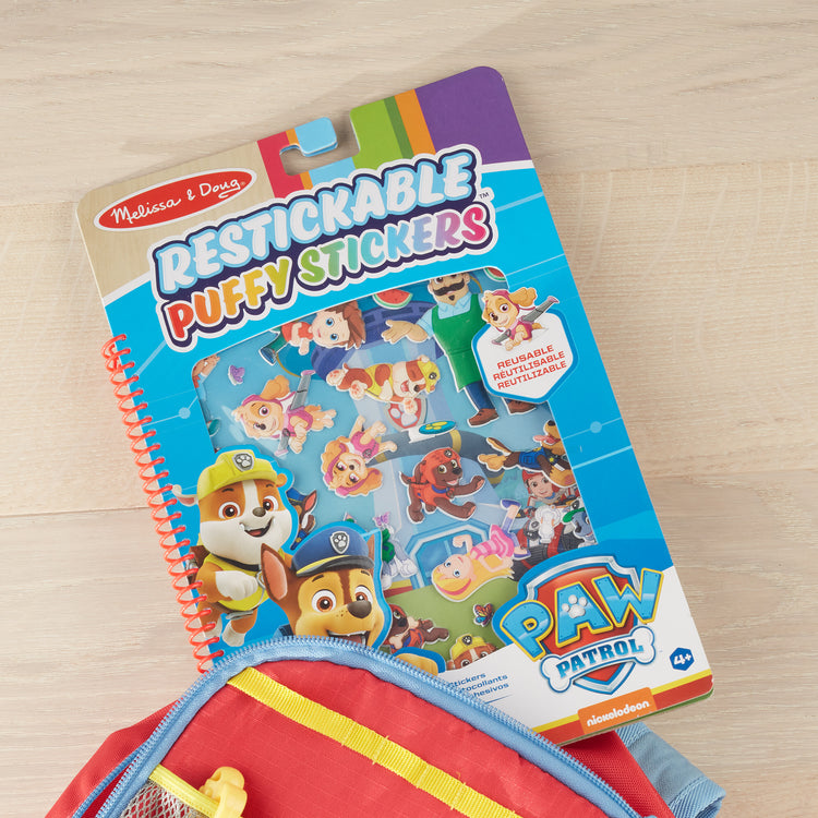 A playroom scene with The Melissa & Doug PAW Patrol Restickable Puffy Stickers - Adventure Bay (31 Reusable Stickers)