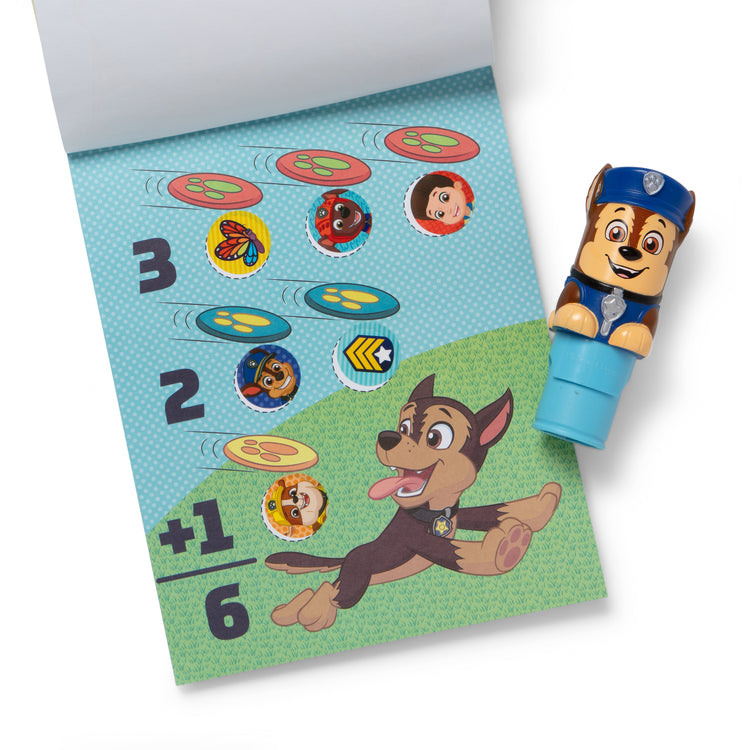 The loose pieces of The Melissa & Doug Sticker WOW!™ PAW Patrol Chase Bundle: 24-Page Activity Pad, Sticker Stamper, 500 Stickers, Mini Pad, Arts and Crafts Fidget Toy Collectible Character