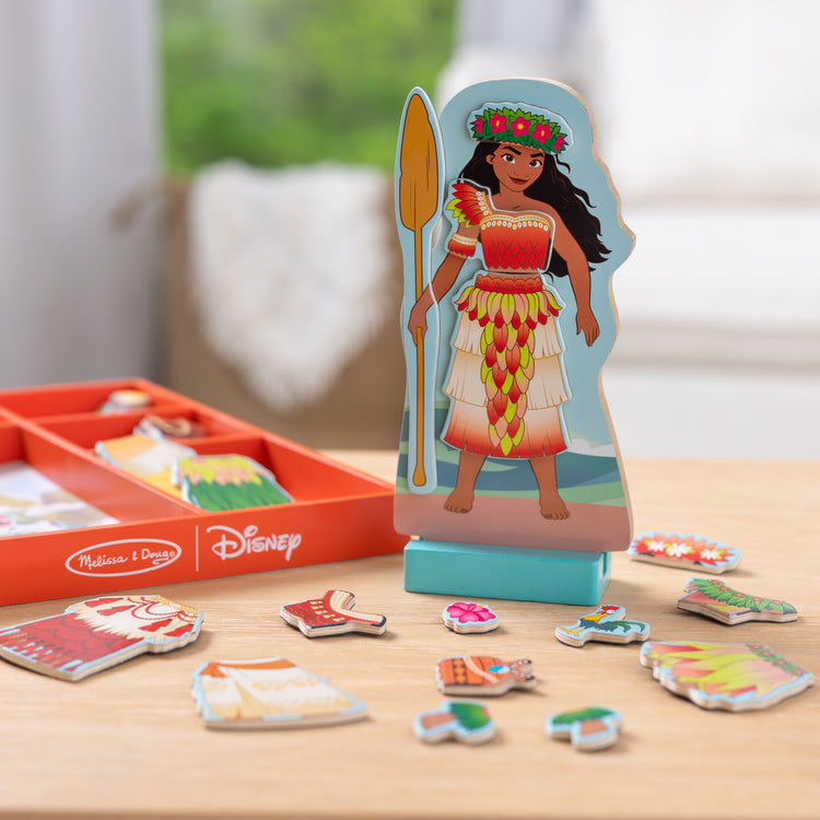 A playroom scene with The Melissa & Doug Disney Princess Moana Magnetic Dress-Up Wooden Doll Pretend Play Set (30+ pcs)
