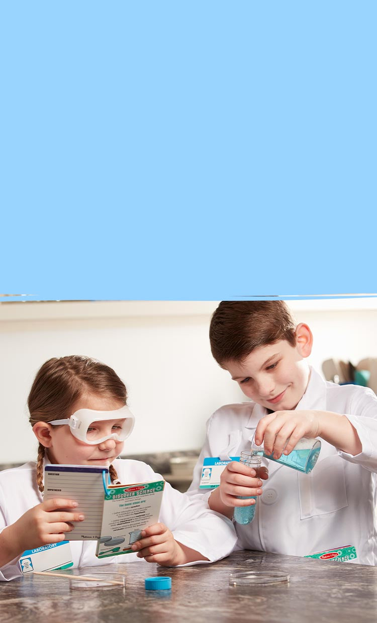image of children playing with science experiement toys