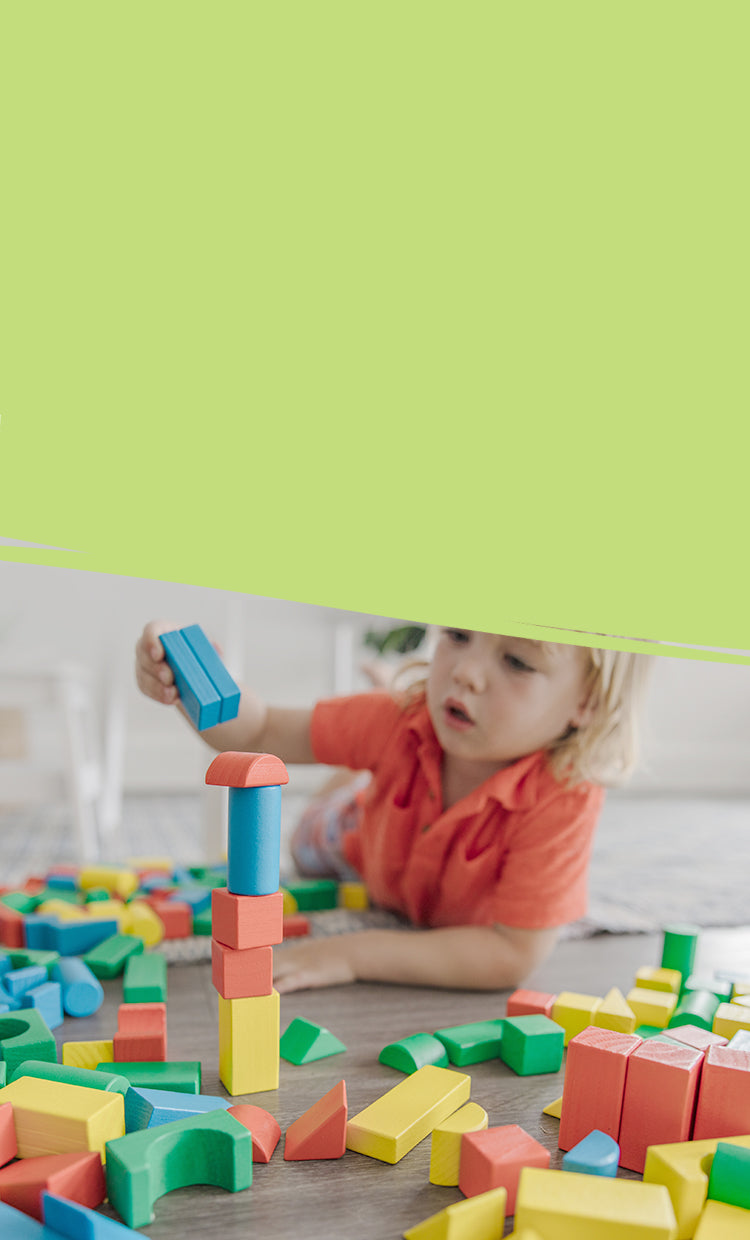 image of child playing with wooden blocks