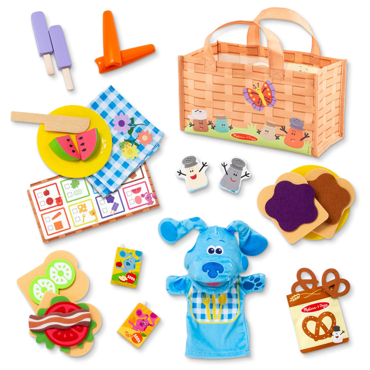 The loose pieces of The Melissa & Doug Blue’s Clues & You! Share with Blue Picnic Play Set with Hand Puppet