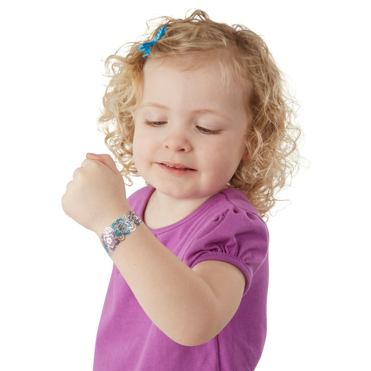 A child on white background with The Temporary Tattoos - Metallic