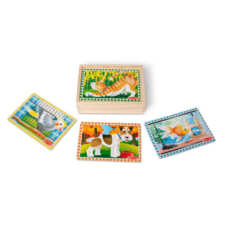 The loose pieces of The Melissa & Doug Pets 4-in-1 Wooden Jigsaw Puzzles in a Storage Box (48 pcs)