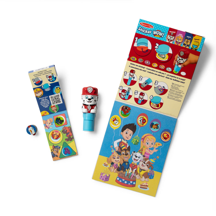 The loose pieces of The Melissa & Doug Sticker WOW!™ PAW Patrol Marshall Bundle: 24-Page Activity Pad, Sticker Stamper, 500 Stickers, Mini Pad, Arts and Crafts Fidget Toy Collectible Character