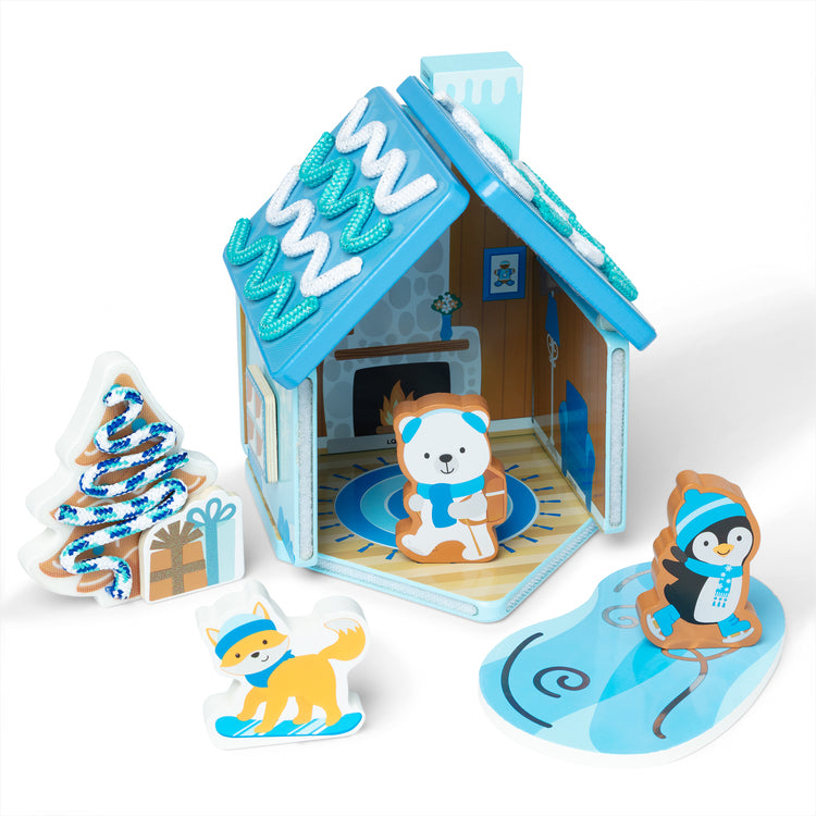 The loose pieces of The Melissa & Doug Winter Frost Wooden Gingerbread House Play Set for Boys and Girls 3+ 
