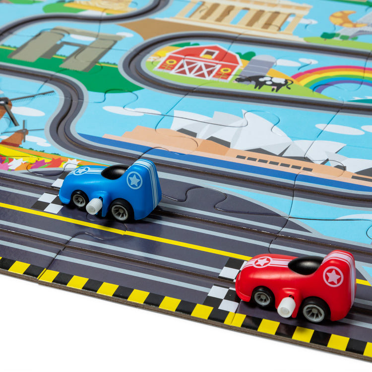 The Melissa & Doug Race Around the World Tracks Cardboard Jigsaw Floor Puzzle and Wind-Up Vehicles – 48 Pieces, for Boys and Girls 3+