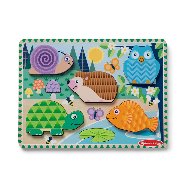 The loose pieces of The Forest Friends Touch & Feel Puzzle