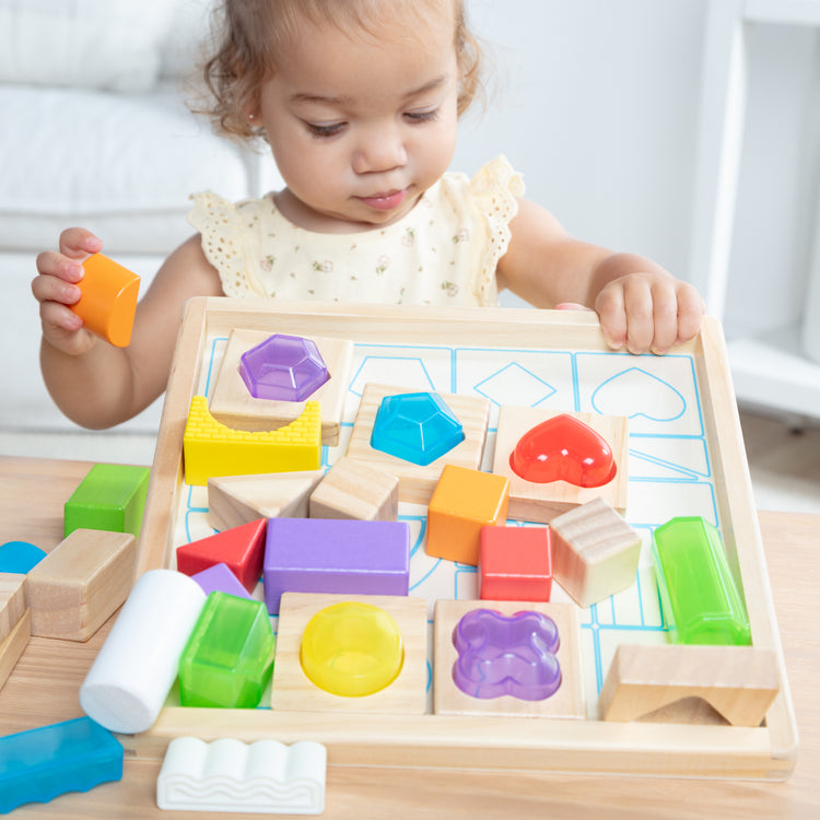 A kid playing with The Sensory Matching Blocks