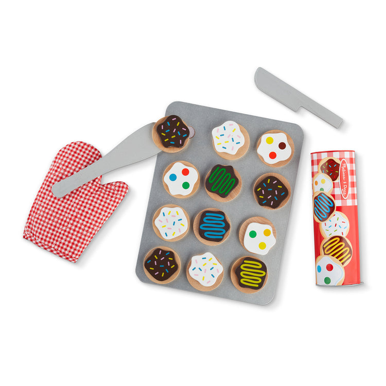 The loose pieces of The Melissa & Doug Slice and Bake Wooden Cookie Play Food Set