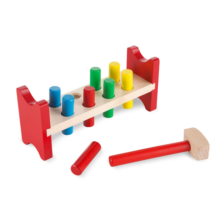 The loose pieces of The Melissa & Doug Deluxe Wooden Pound-A-Peg Toy With Hammer