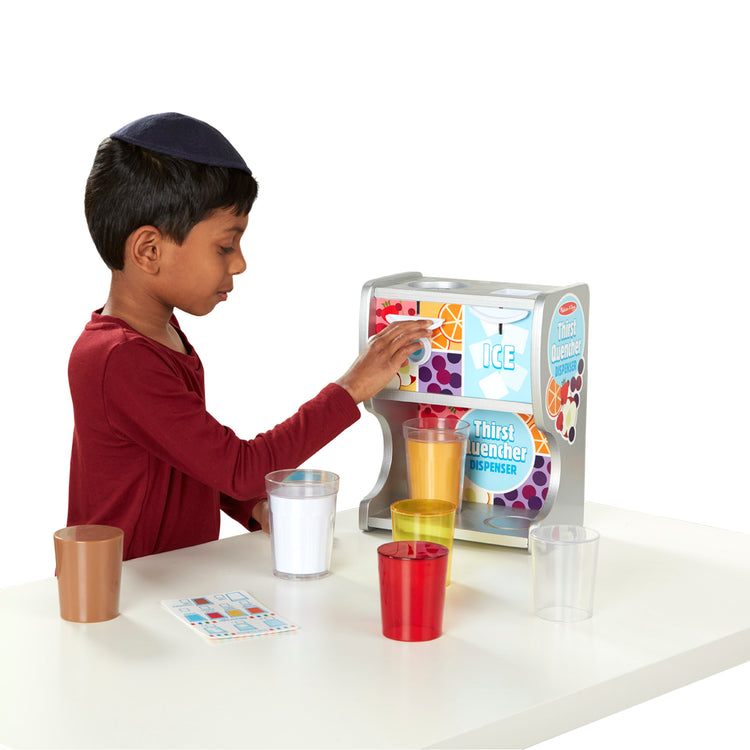 A child on white background with The Melissa & Doug Wooden Thirst Quencher Drink Dispenser With Cups, Juice Inserts, Ice Cubes