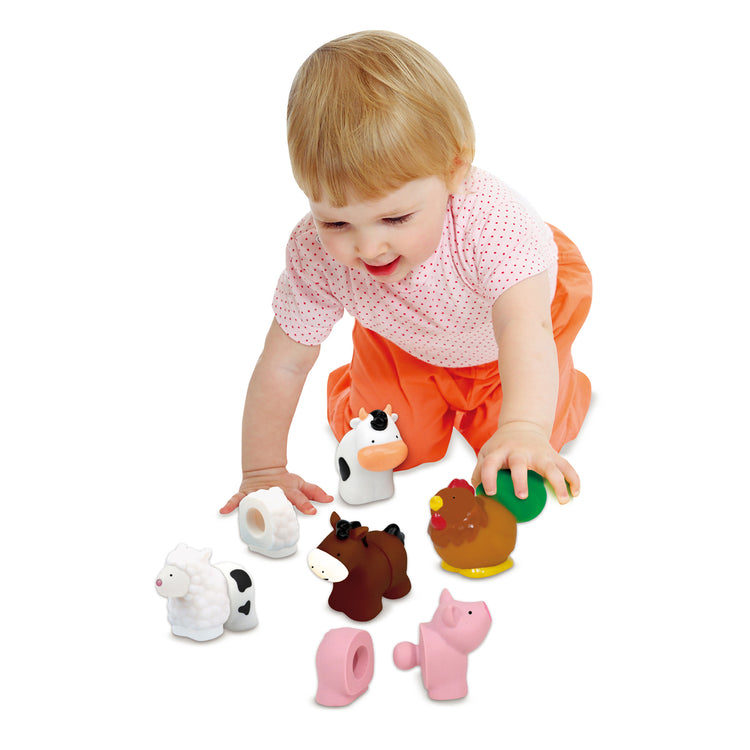 A child on white background with The Melissa & Doug Pop Blocs Farm Animals Educational Baby Toy - 10 Linkable Pieces