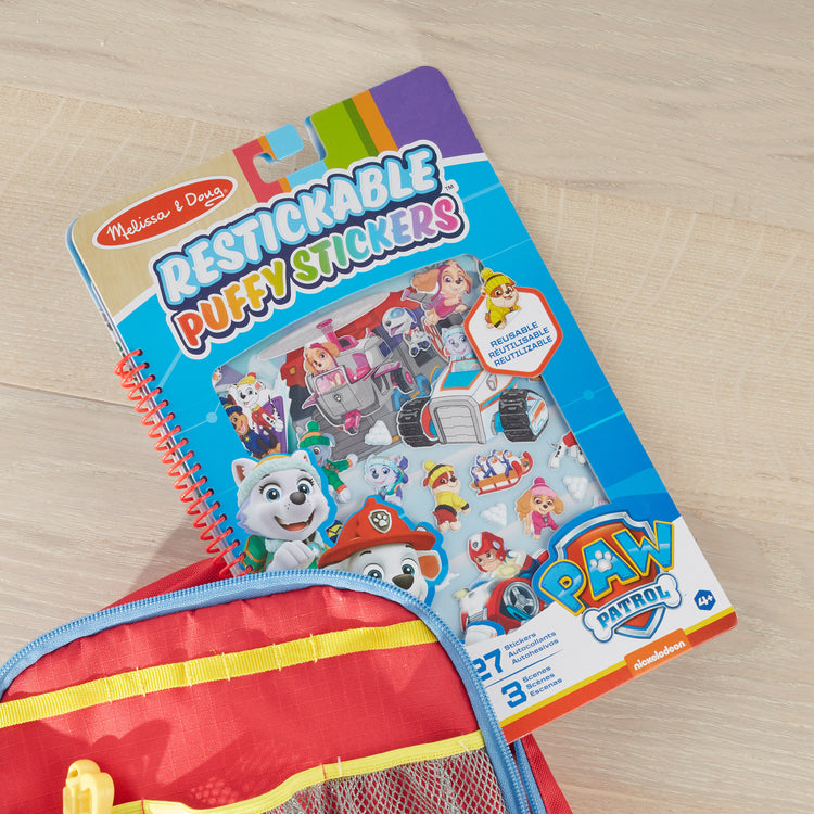 A playroom scene with The Melissa & Doug PAW Patrol Restickable Puffy Stickers -  Jake's Mountain (27 Reusable Stickers)