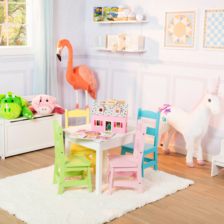 A playroom scene with The Melissa & Doug Pink Faux Leather Child’s Crown-Back Armchair (Kid’s Furniture)