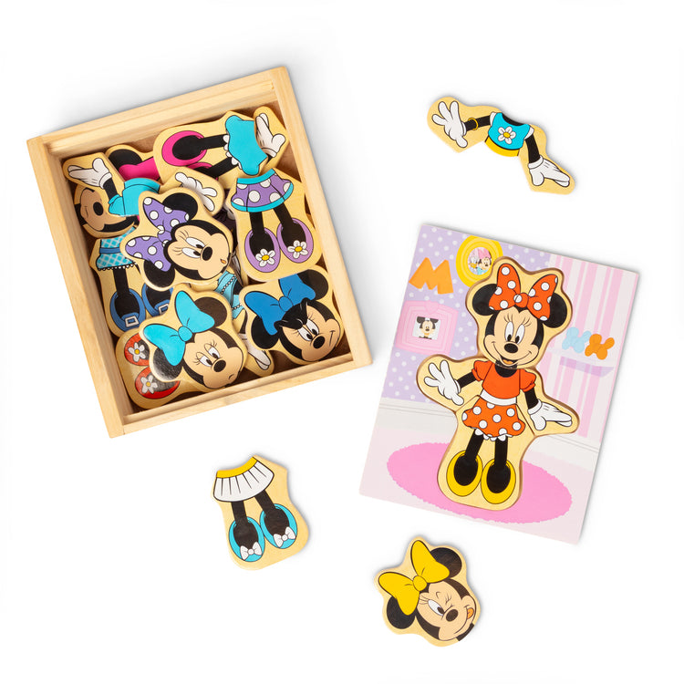The loose pieces of The Melissa & Doug Disney Minnie Mouse Mix and Match Dress-Up Wooden Play Set Puzzle (18 pcs)