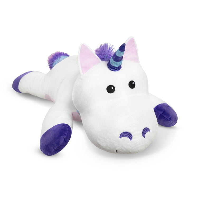 The loose pieces of The Melissa & Doug Cuddle Unicorn Jumbo Plush Stuffed Animal with Activity Card