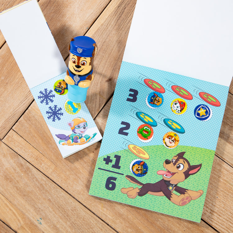 A playroom scene with The Melissa & Doug Sticker WOW!™ PAW Patrol Chase Bundle: 24-Page Activity Pad, Sticker Stamper, 500 Stickers, Mini Pad, Arts and Crafts Fidget Toy Collectible Character