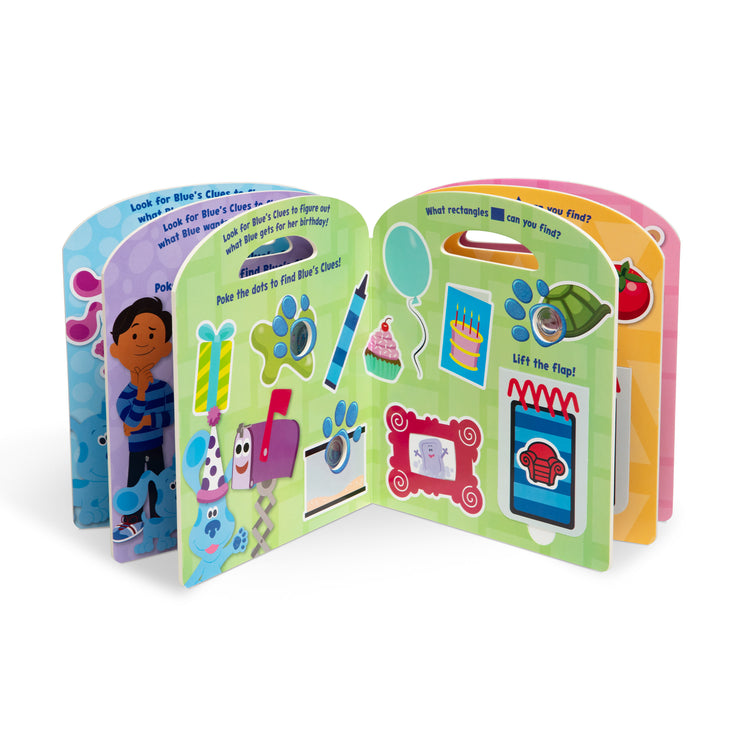 The loose pieces of The Melissa & Doug Blue's Clues & You! Children's Book - Poke-A-Dot: Shapes with Blue