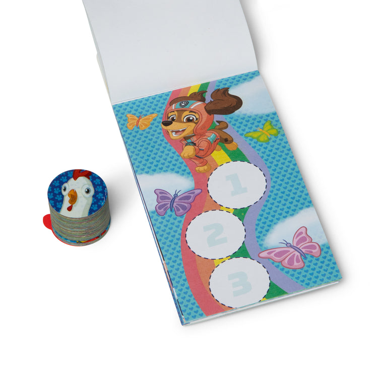 The loose pieces of The Melissa & Doug Sticker WOW!™ Mini Activity Pad and 200+ Refill Stickers for Sticker Stamper Arts and Crafts Fidget Toy Collectibles – PAW Patrol Stickers