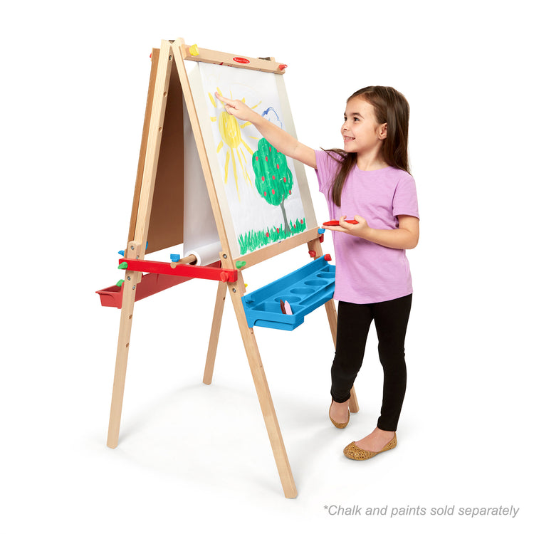 A child on white background with The Melissa & Doug Easel Paper Roll - 17 Inches Wide, 75 Feet Long for Painting, Drawing, Art and Craft Projects for Kids