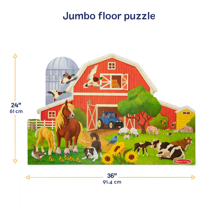 A kid playing with The Melissa & Doug Busy Barn Shaped Jumbo Floor Puzzle, 32-Piece Barn-Shaped Jigsaw Puzzle with Farm Animals, 3 x 2 Foot Toddler Puzzles for Kids Ages 3+